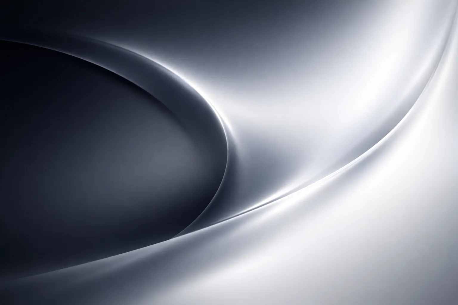 Silver silk folding into itself in soft monochrome light